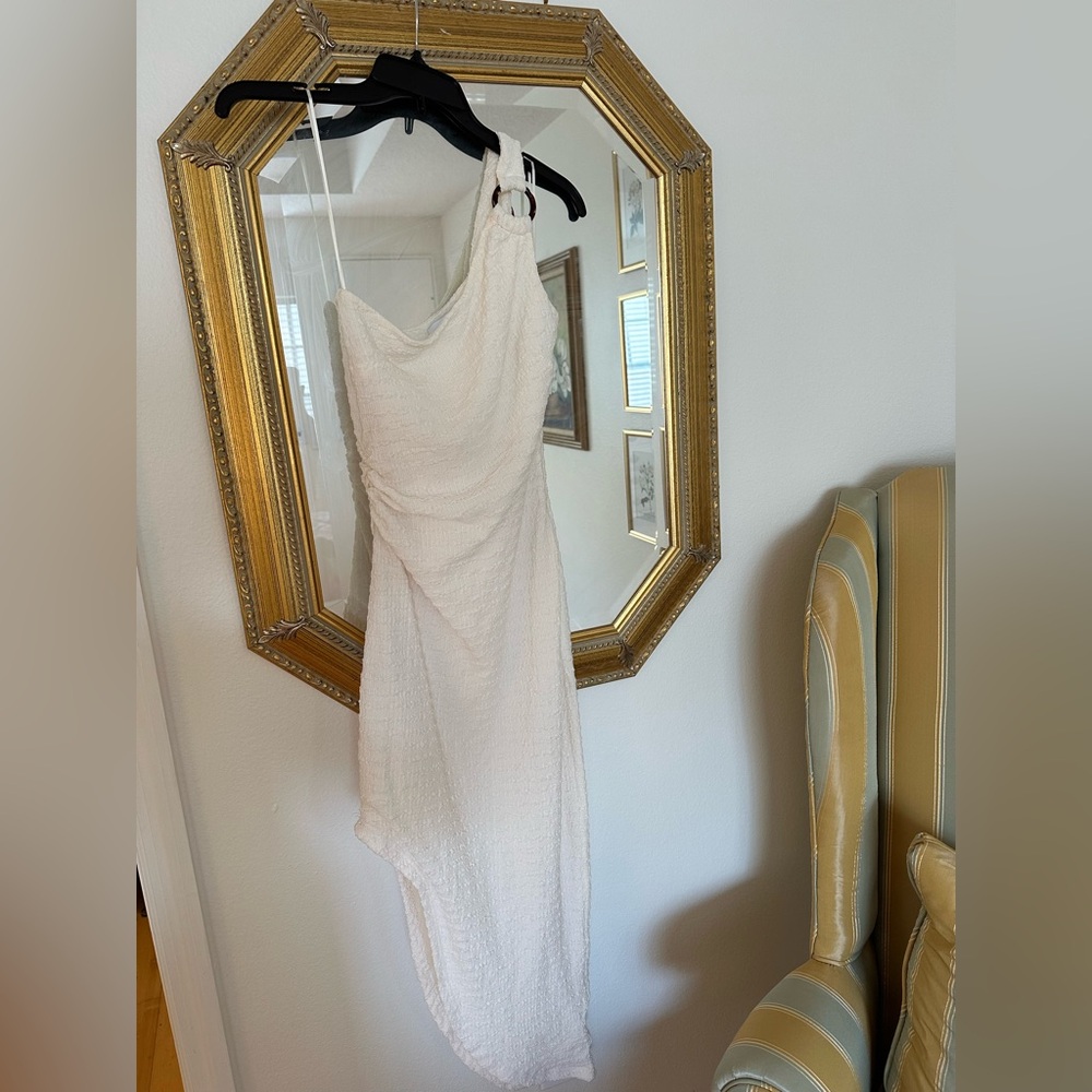 LIKELY cream asymmetrical dress.  Worn once on a first date, it’s perfect !